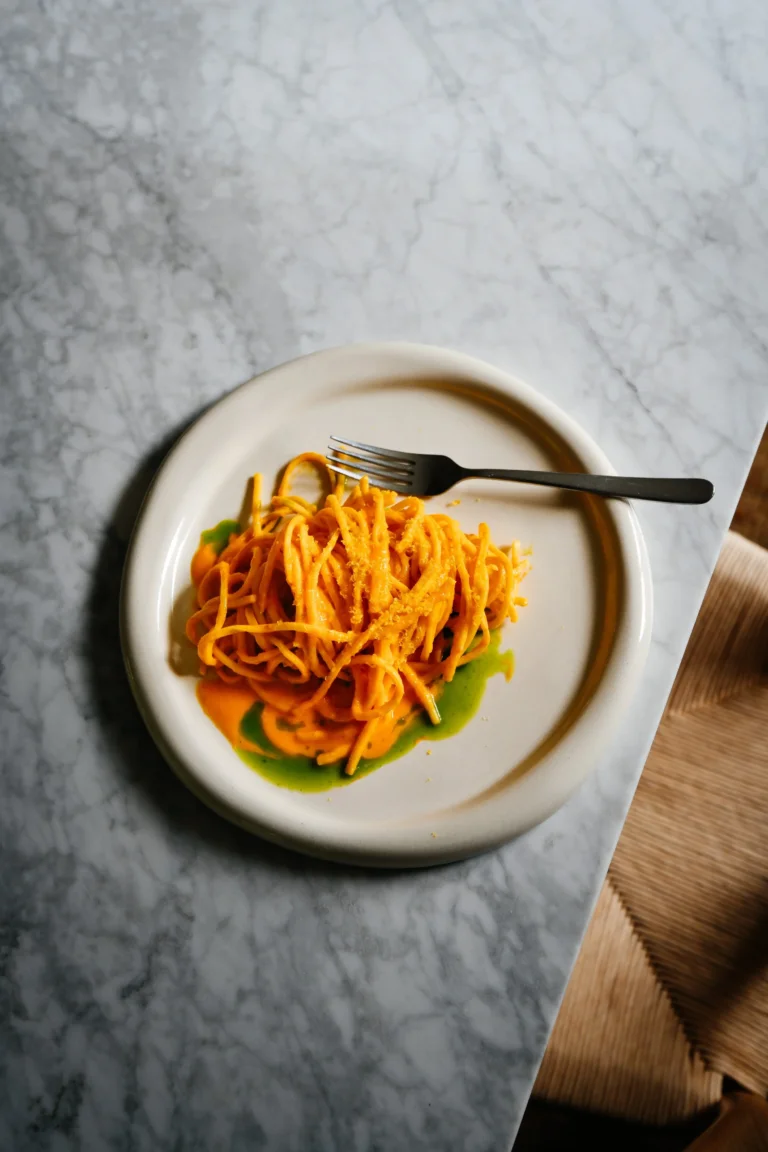 Spaghetti alla Chitarra with Yellow Tomato Sugo, Basil Oil and Cured Yolk