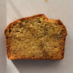 A single slice of brown butter banana bread taken from above so the full crumb is visible.