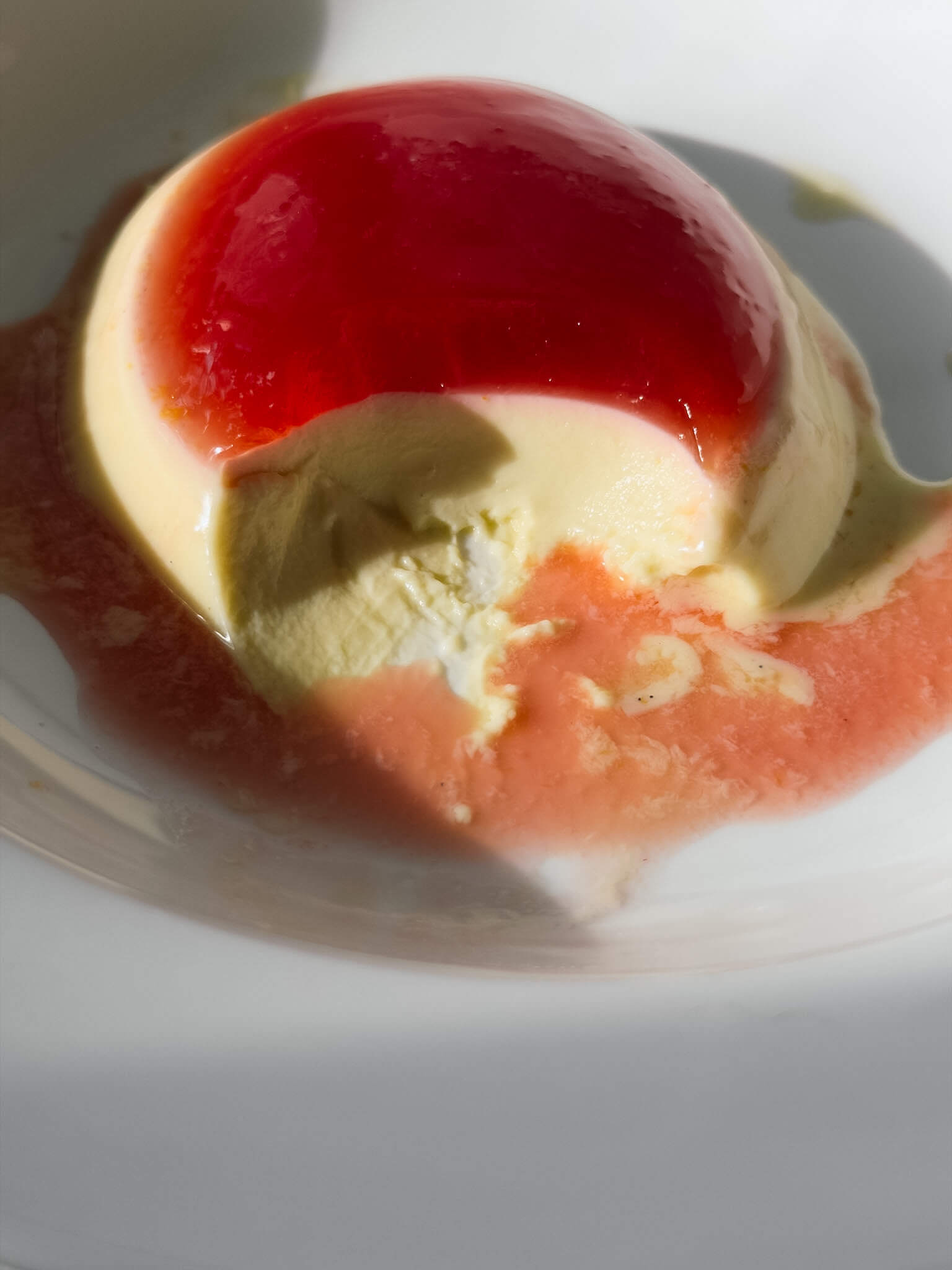 A close up photo of a layered panna cotta, 